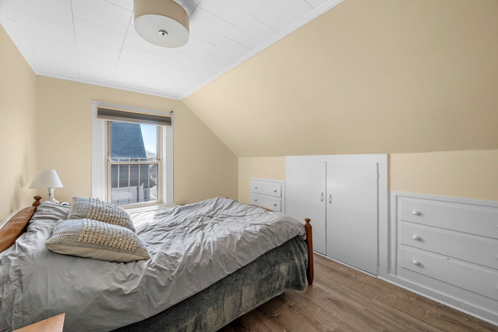 36 Stone Street Beverly, MA 01915 - Photo 29 of 42 a bedroom with a bed and cabinet