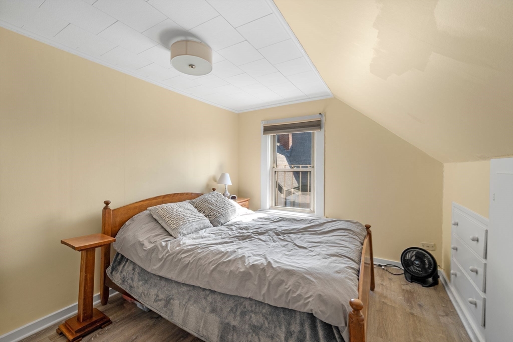 36 Stone Street Beverly, MA 01915 - Photo 30 of 42 a bedroom with a bed and a dresser