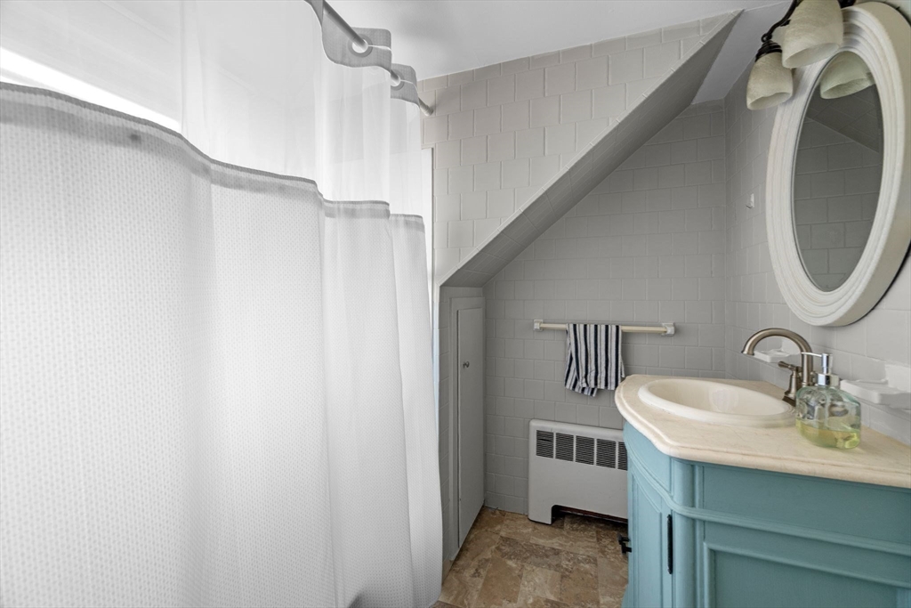 36 Stone Street Beverly, MA 01915 - Photo 31 of 42 a bathroom with a sink and a mirror