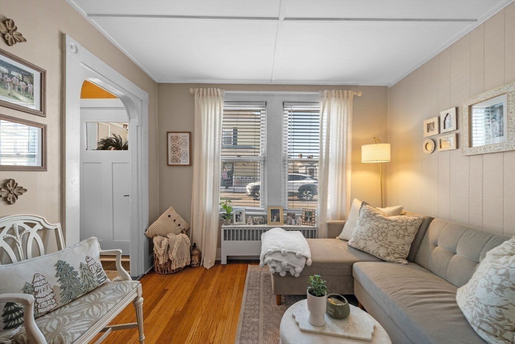 36 Stone Street Beverly, MA 01915 - Photo 9 of 42 a living room with furniture and a large window