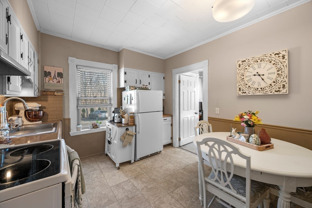 36 Stone Street Beverly, MA 01915 - Photo 10 of 42 a kitchen that has a refrigerator and stove