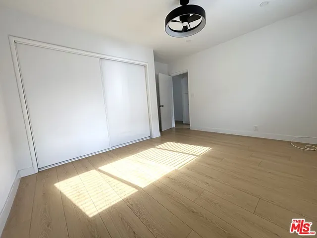 an empty room with a empty space and a window