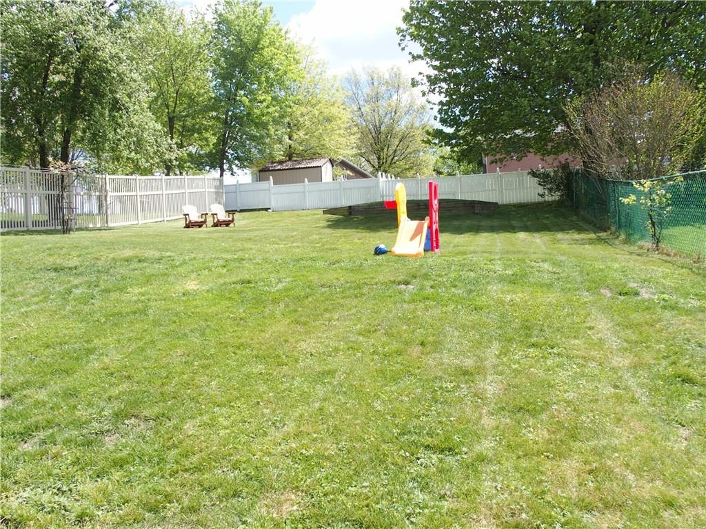 Great rear yard, almost completely fenced in, plenty of room for entertaining, summer BBQs, gardening, whatever you enjoy! 
