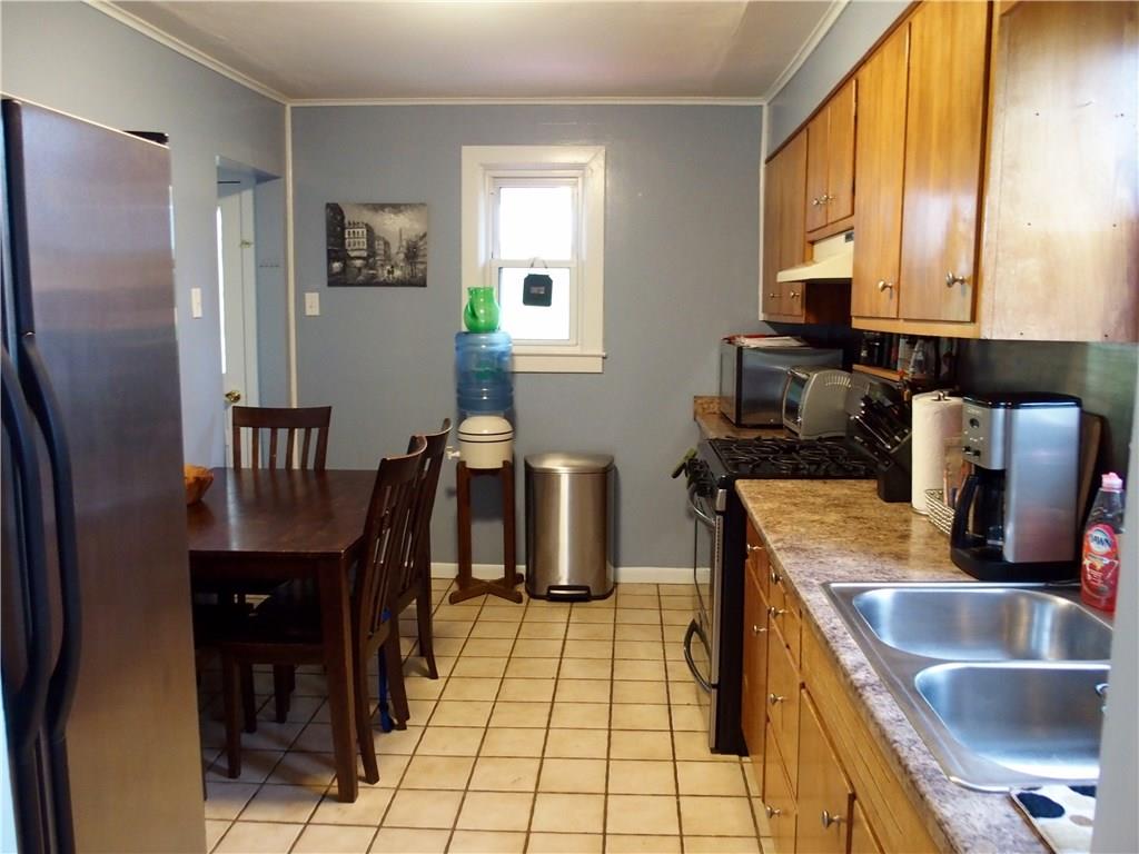 168 Altman Road Jeannette, PA 15644 - Photo 11 of 15 Room for a full size table and access to the rear yard, as well as ample counter space.
