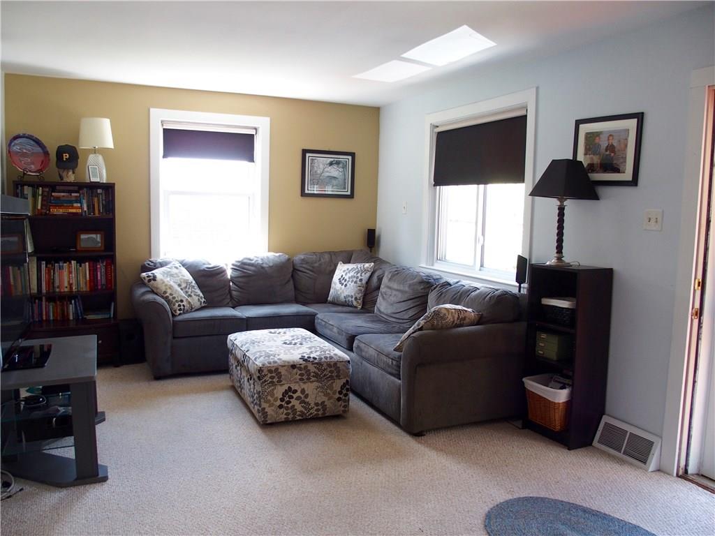 Living room is nice and bright and warm and inviting!