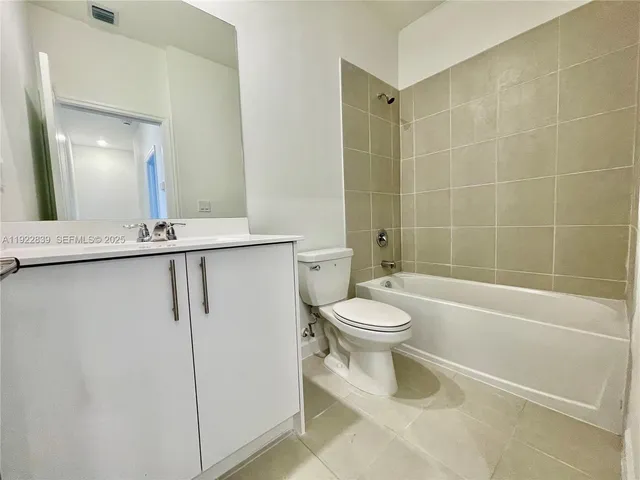 a bathroom with a toilet a sink and a shower