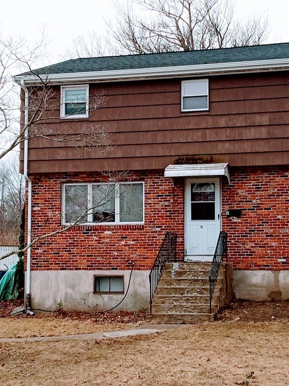 a front view of a house with large windows