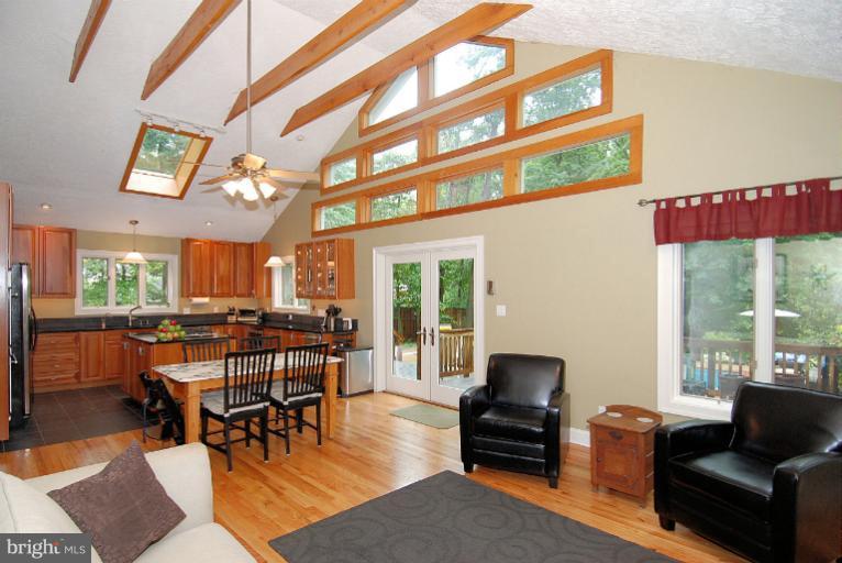 600 Utterback Store Road Great Falls, VA 22066 - Photo 14 of 30 a living room with furniture and a large window