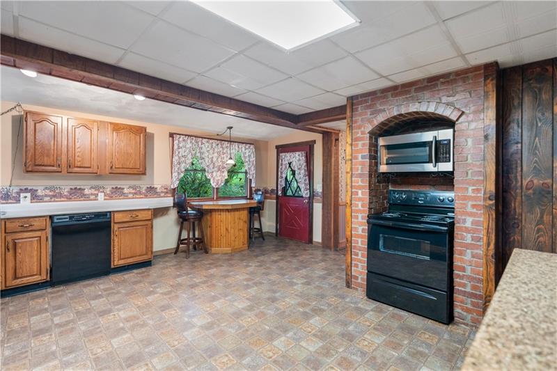 218 Outcrop Road Smithfield, PA 15478 - Photo 11 of 21 a kitchen with stainless steel appliances granite countertop a stove and a refrigerator