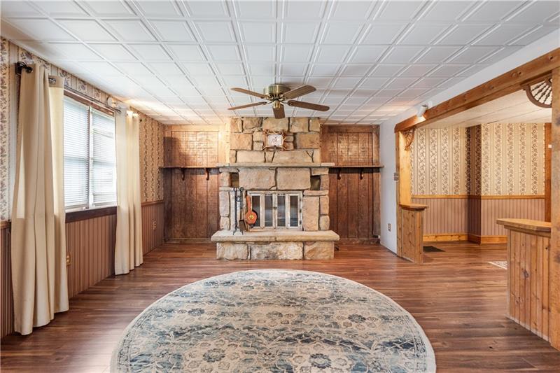 218 Outcrop Road Smithfield, PA 15478 - Photo 14 of 21 a view of a hallway with wooden floor and chandelier