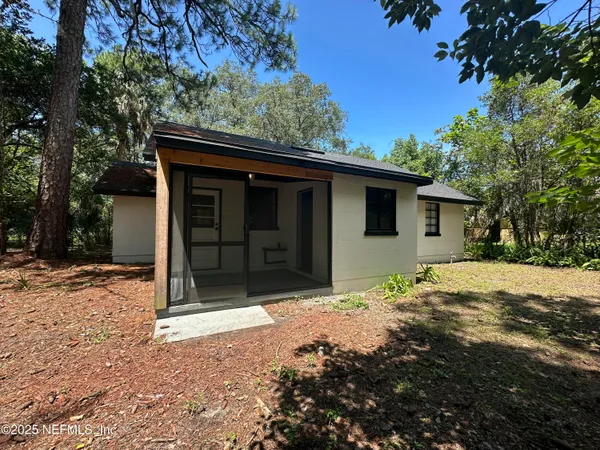 a house with trees in the background