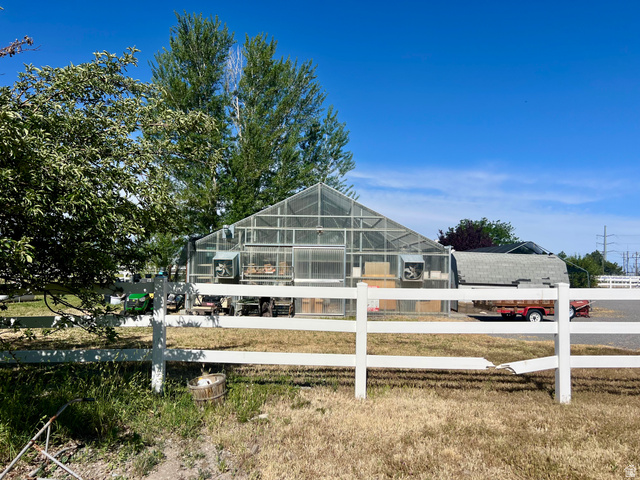 812 East Bates Cyn Road Tooele, UT 84074 - Photo 119 of 144 Large-scale greenhouse structure featuring transparent paneling and integrated ventilation systems