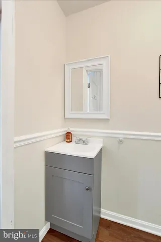 a view white cabinet with wooden floor
