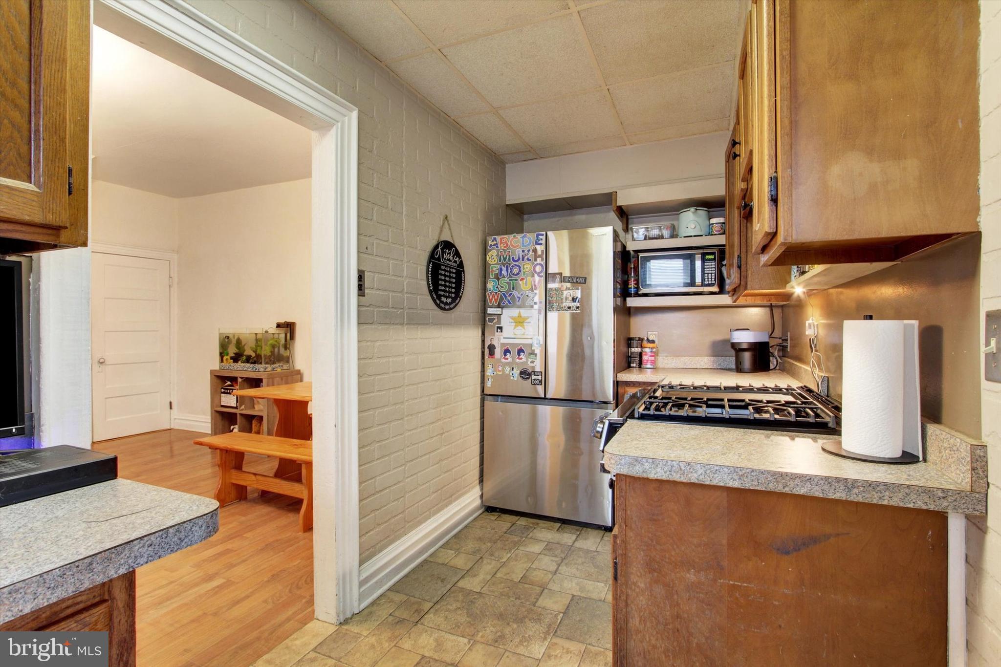 614 Broadway Hanover, PA 17331 - Photo 15 of 33 a kitchen with stainless steel appliances granite countertop a stove and a refrigerator