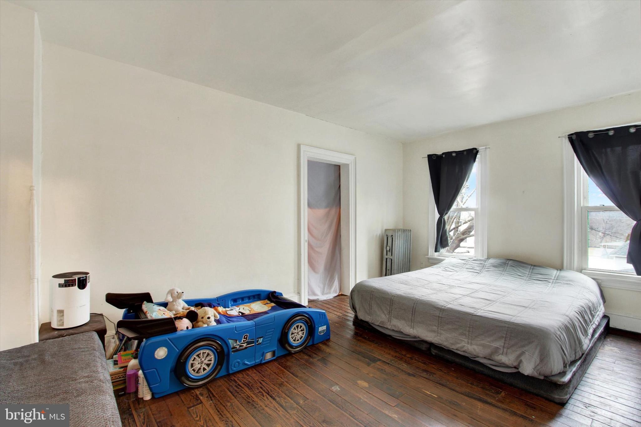 614 Broadway Hanover, PA 17331 - Photo 17 of 33 a bedroom with a bed and a car