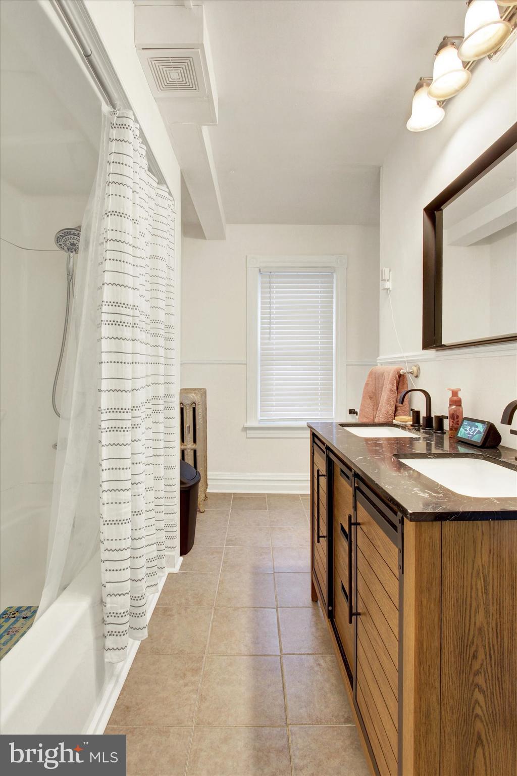 614 Broadway Hanover, PA 17331 - Photo 19 of 33 a bathroom with a sink a toilet and shower