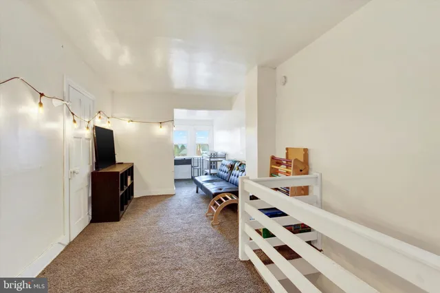 a large white room with lots of white furniture