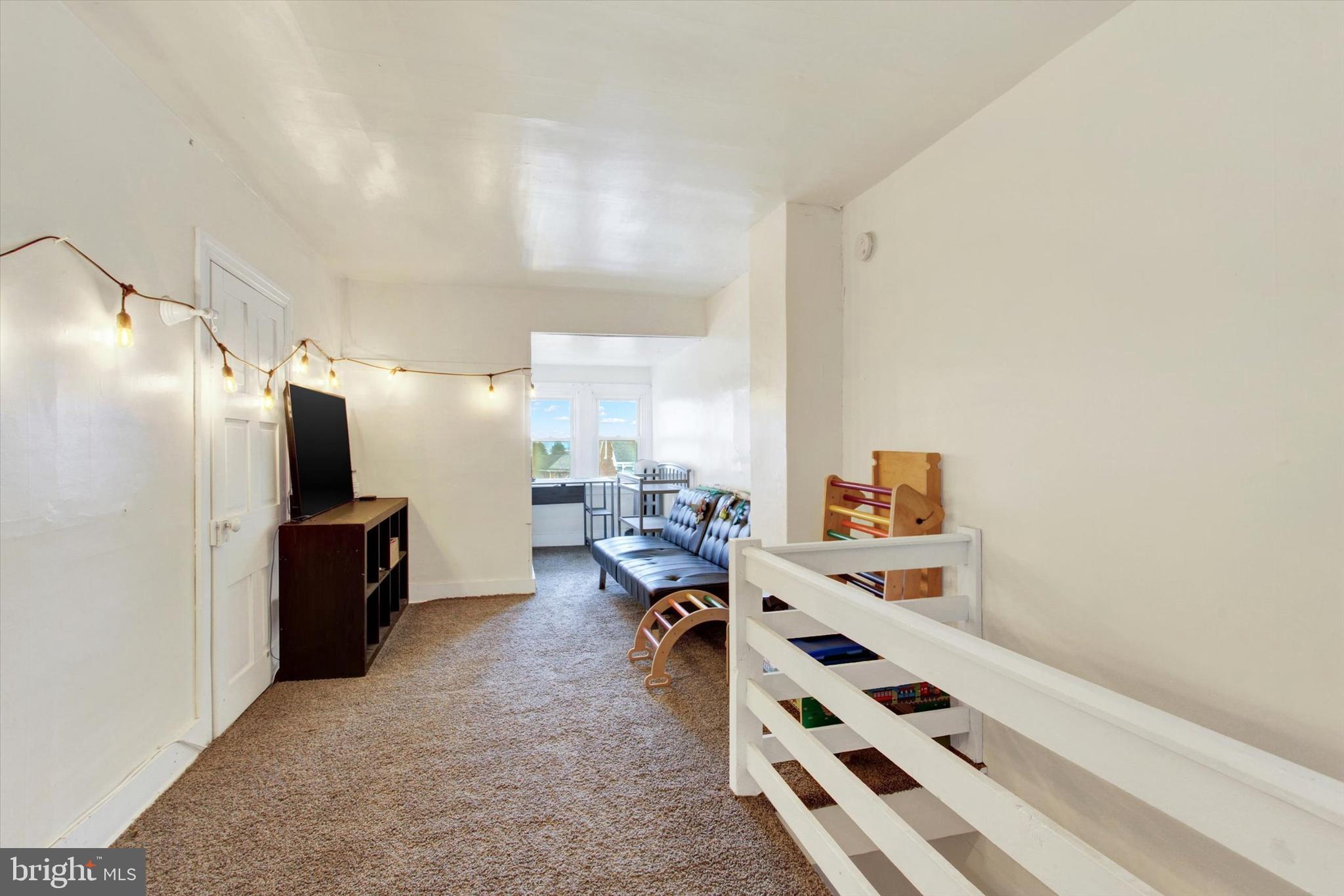 614 Broadway Hanover, PA 17331 - Photo 23 of 33 a large white room with lots of white furniture