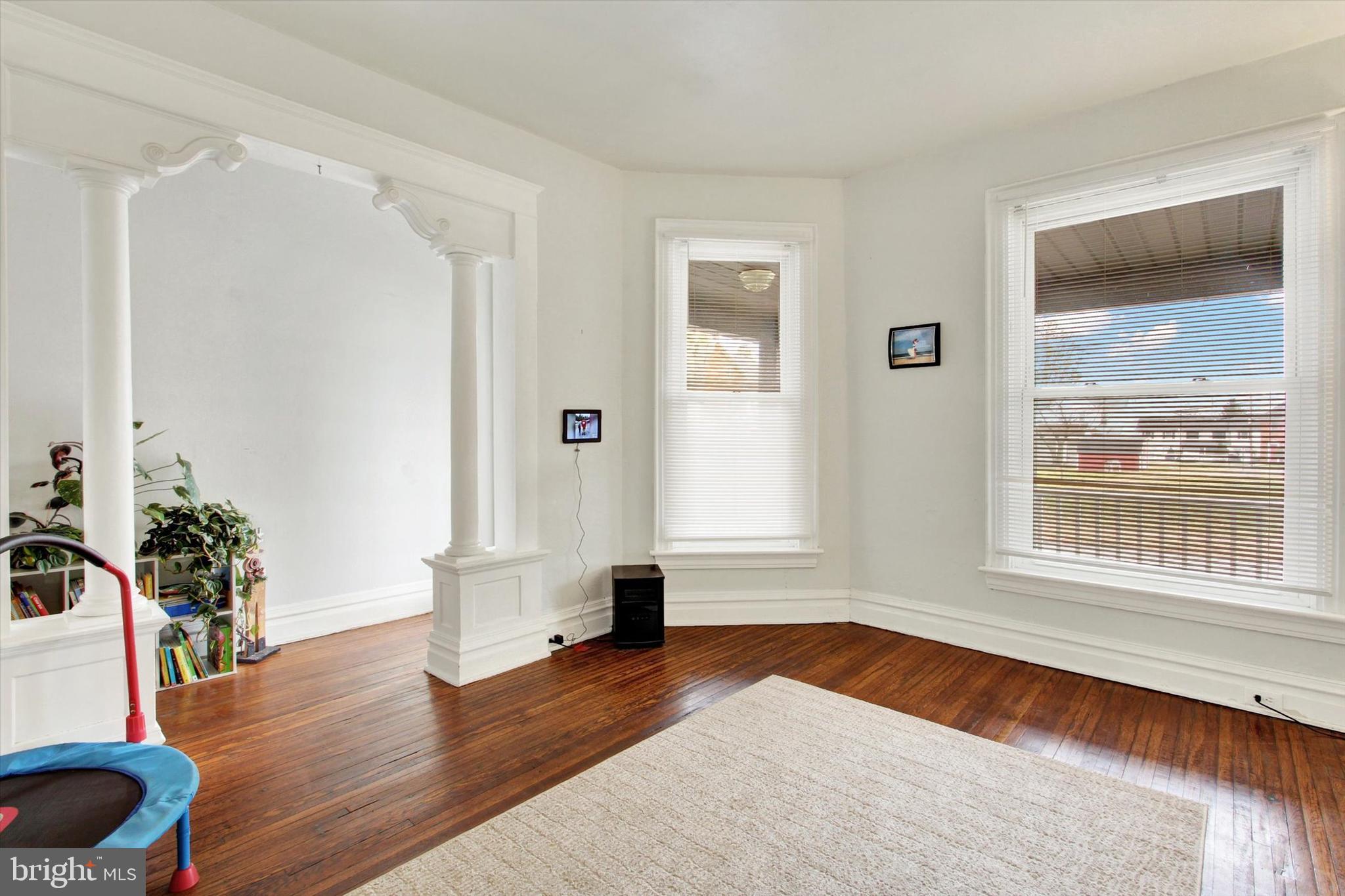 614 Broadway Hanover, PA 17331 - Photo 5 of 33 a view of empty room with wooden floor and fan