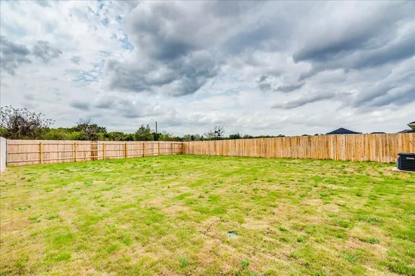 a view of a yard with swimming pool and wooden floor