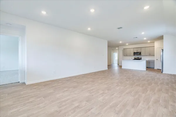 a view of kitchen and refrigerator