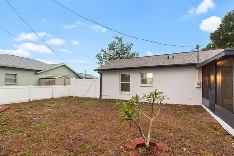 a view of a house with a backyard