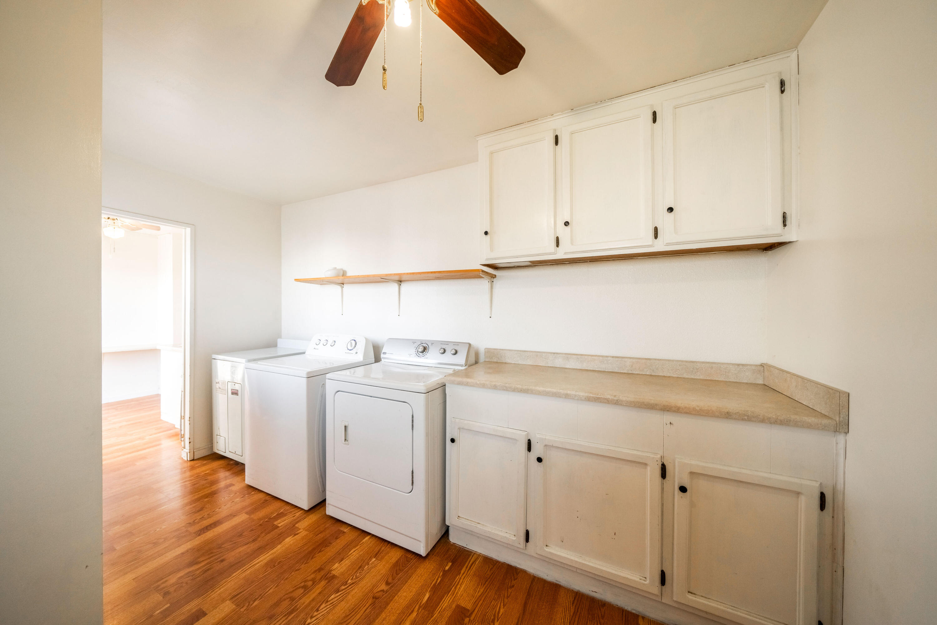 240 Kimball Road Red Bluff, CA 96080 - Photo 19 of 56 a view of storage and utility room with wooden floor