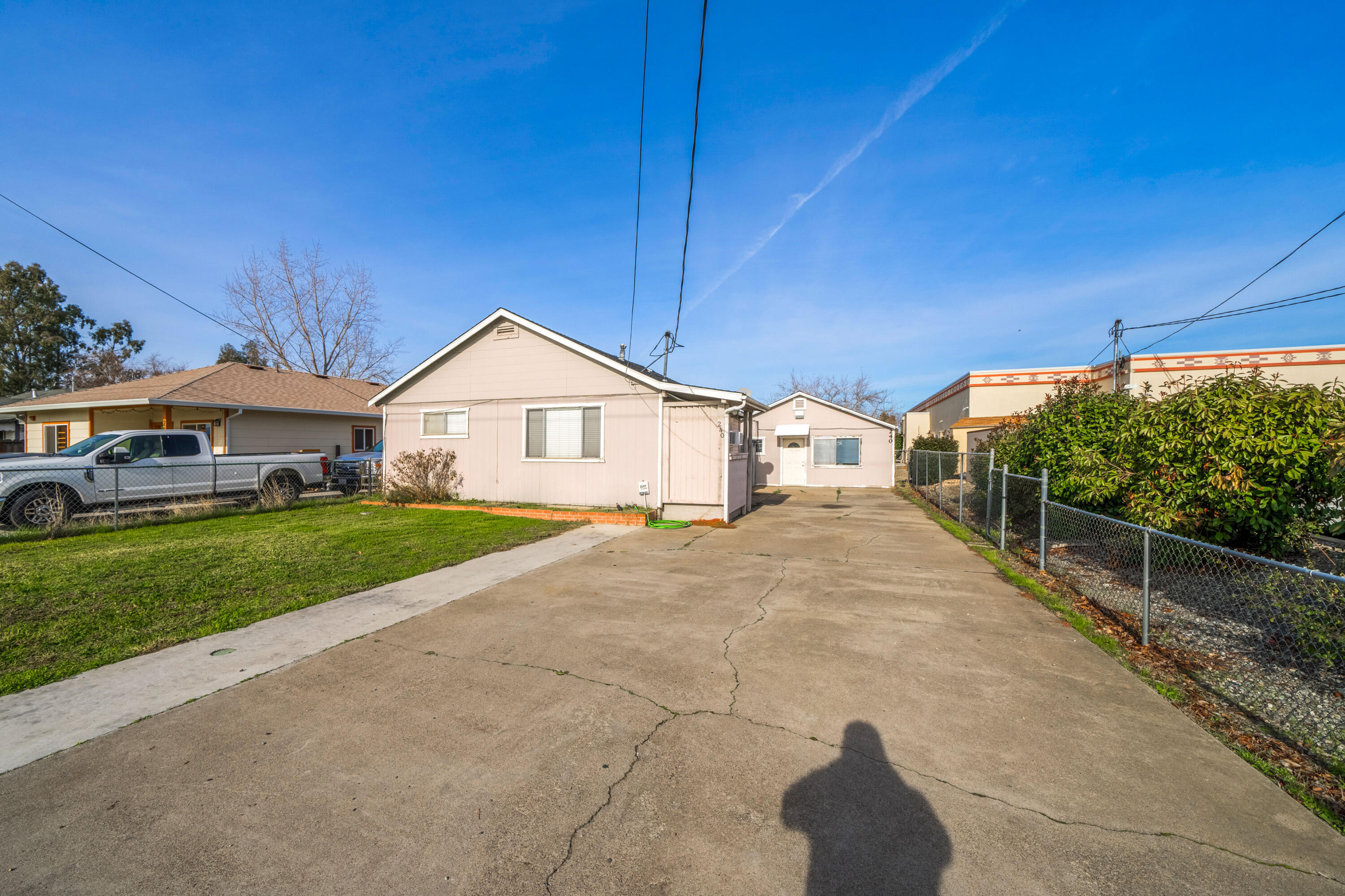 240 Kimball Road Red Bluff, CA 96080 - Photo 2 of 56 a front view of a house with a yard and garage