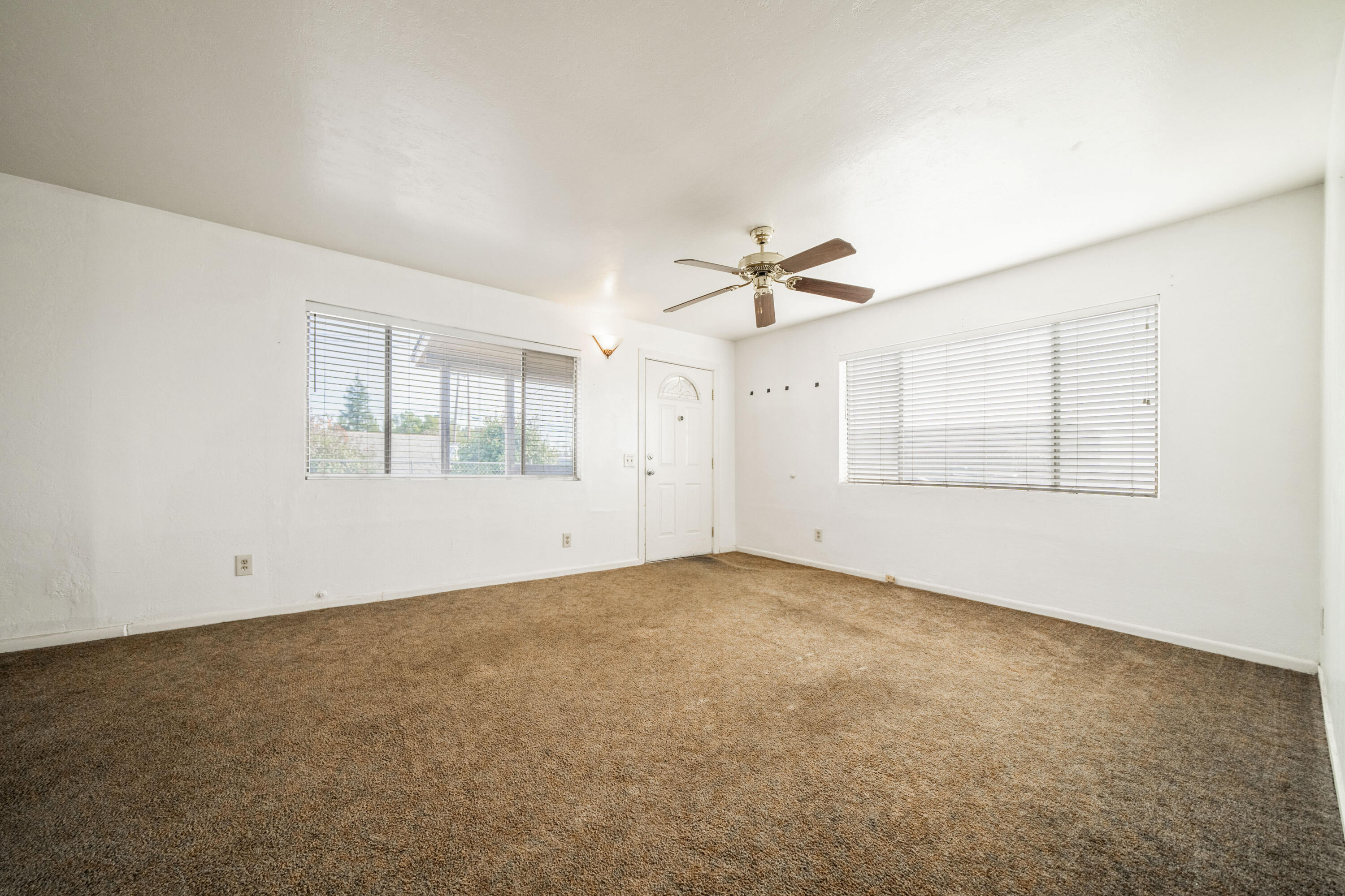 240 Kimball Road Red Bluff, CA 96080 - Photo 7 of 56 an empty room with a empty space and windows