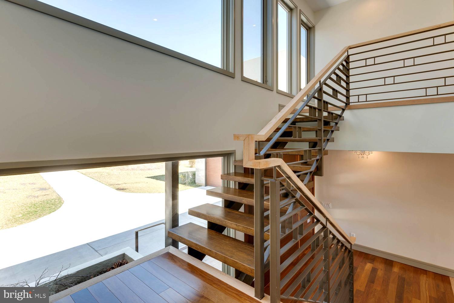 328 Hickory Point Road Pasadena, MD 21122 - Photo 27 of 49 Floating Staircase with Decorative Steel Railings
