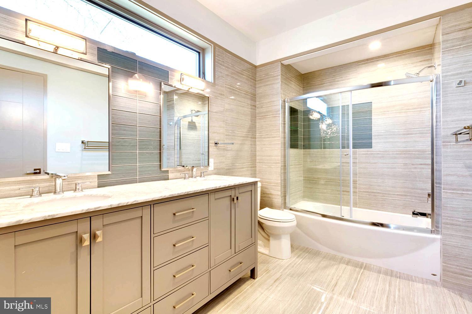 328 Hickory Point Road Pasadena, MD 21122 - Photo 37 of 49 Porcelain Tile Bath . Dual Marble-Topped Vanity