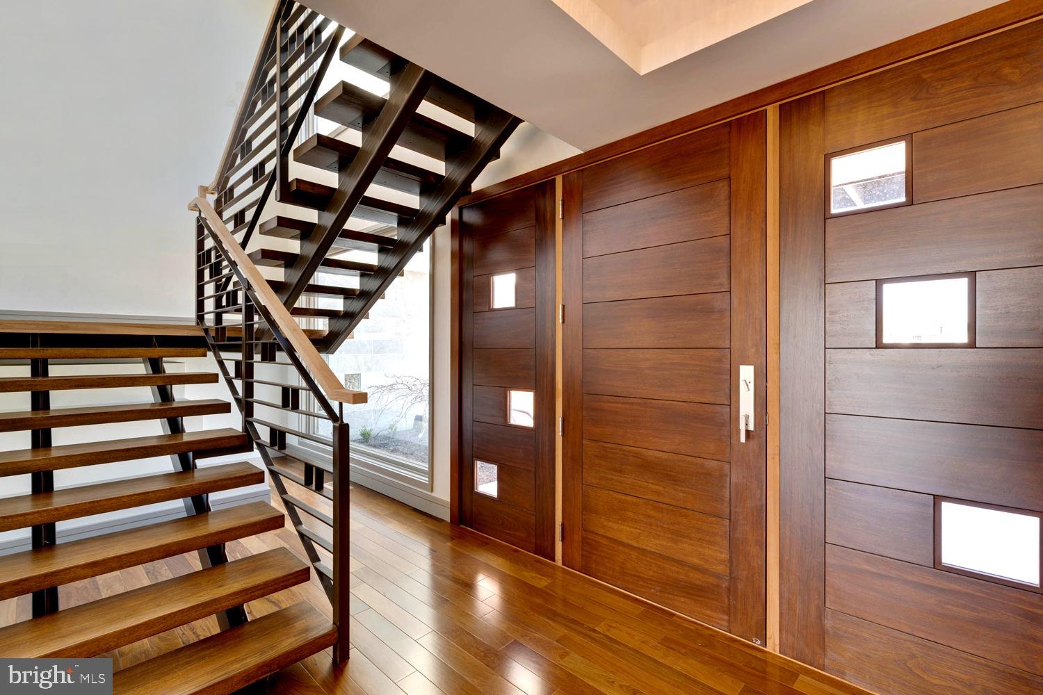 328 Hickory Point Road Pasadena, MD 21122 - Photo 8 of 49 Entry w/African Mahogany Door . Floating Staircase