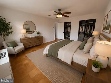 a bedroom with a bed a couch and dresser