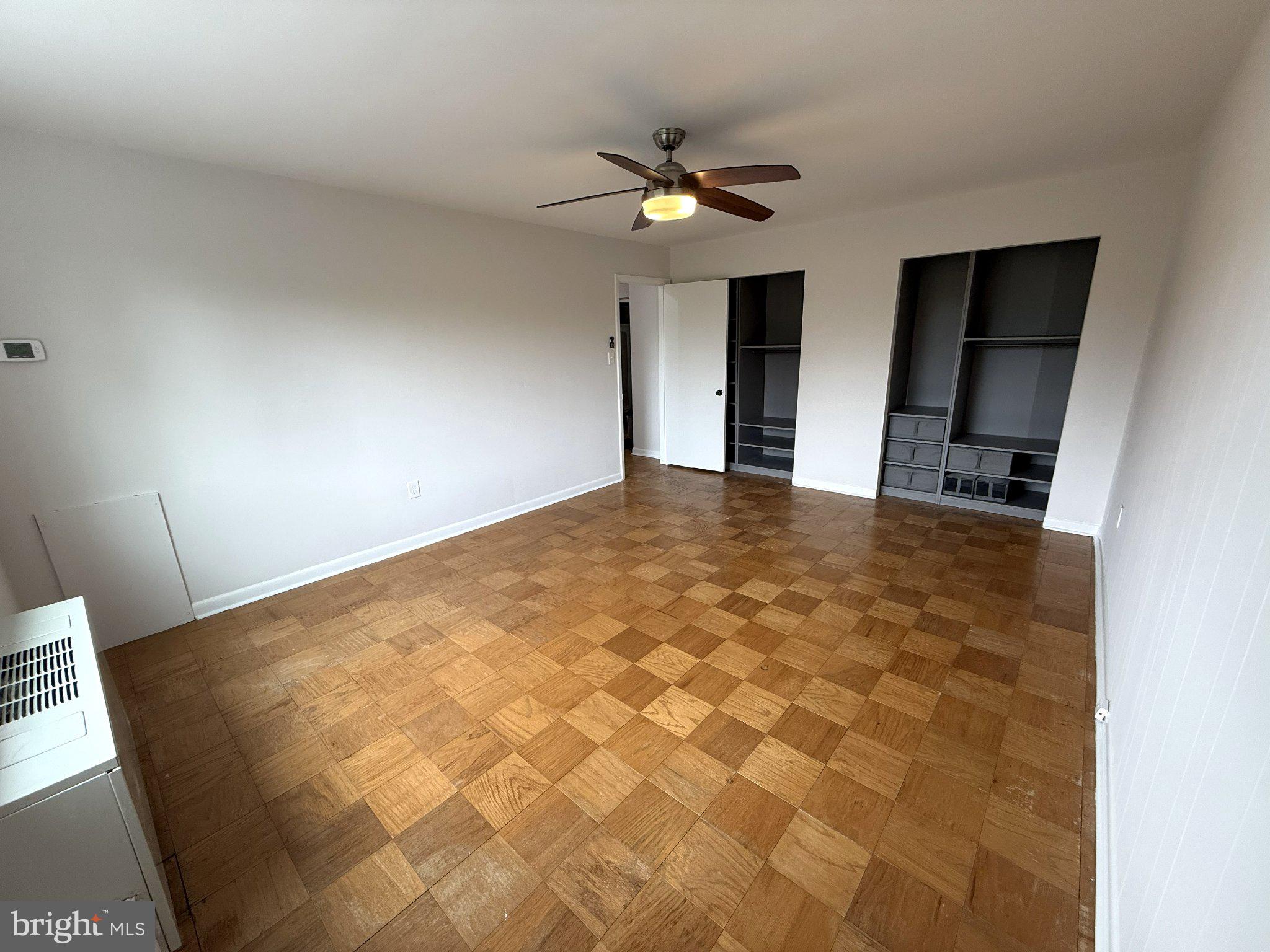 614 Sligo Avenue, Unit 411 Silver Spring, MD 20910 - Photo 16 of 24 a view of a livingroom with a ceiling fan and window
