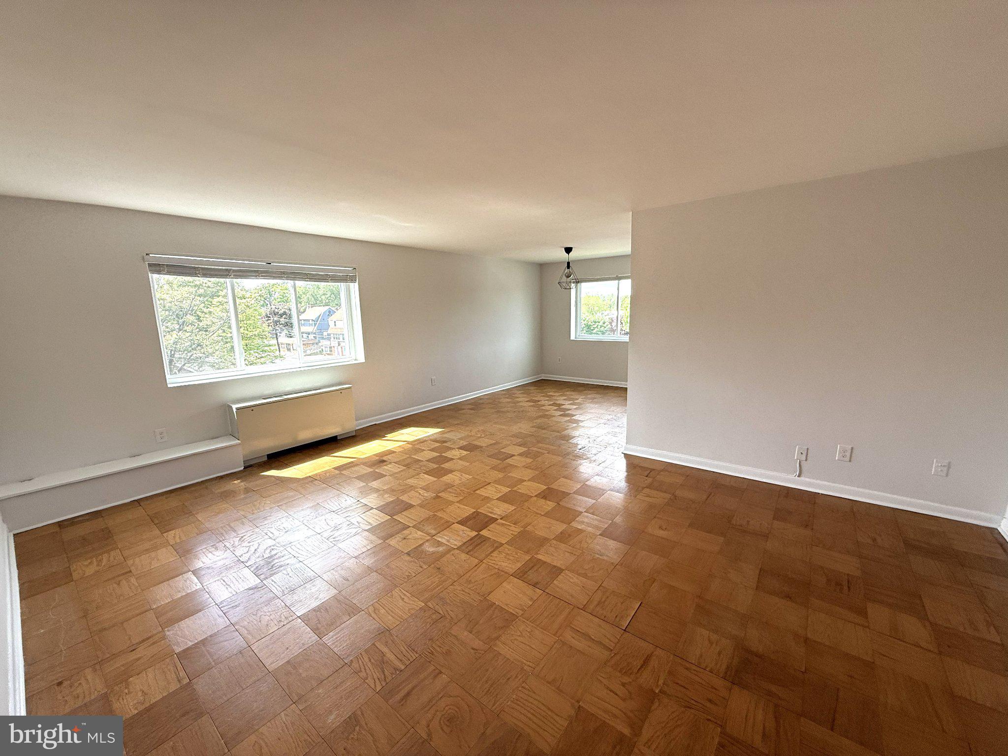 614 Sligo Avenue, Unit 411 Silver Spring, MD 20910 - Photo 2 of 24 an empty room with windows