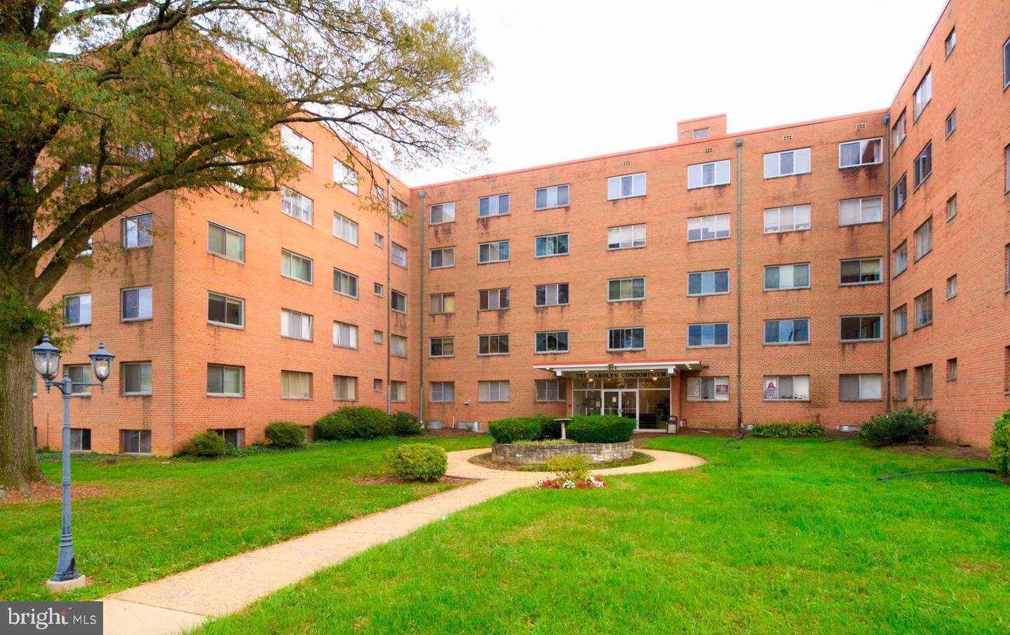 614 Sligo Avenue, Unit 411 Silver Spring, MD 20910 - Photo 21 of 24 a view of a building with a yard