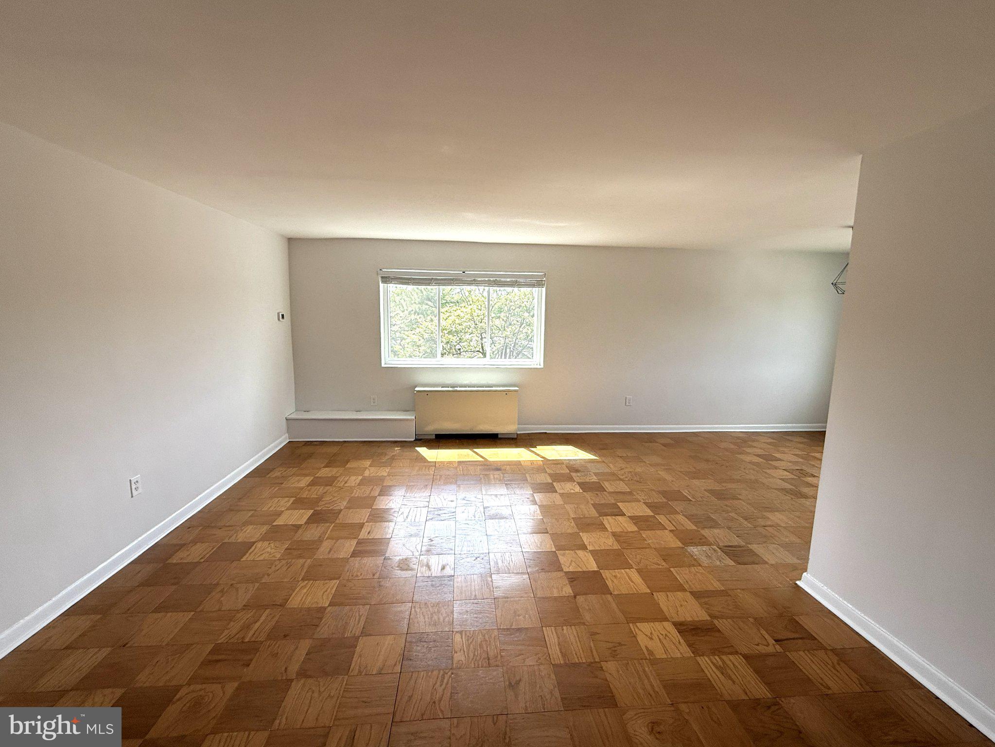 614 Sligo Avenue, Unit 411 Silver Spring, MD 20910 - Photo 4 of 24 an empty room with a empty space and window