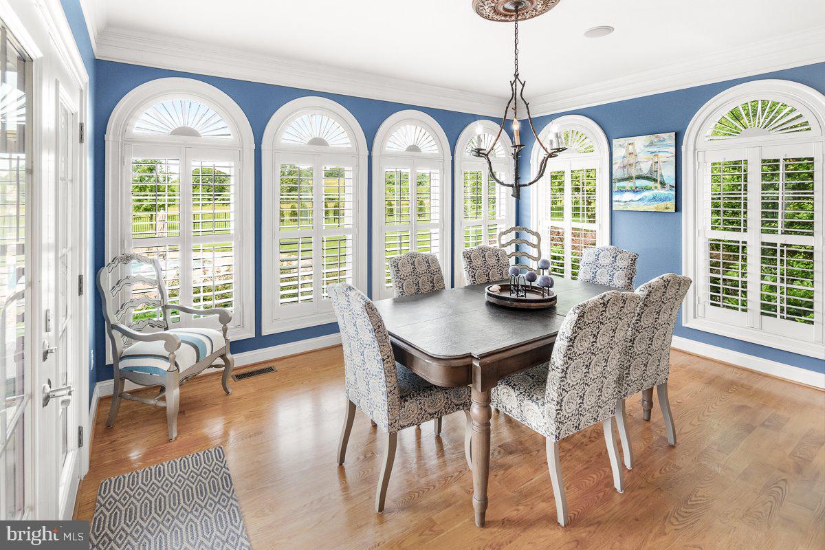 8170 Hollow Road Middletown, MD 21769 - Photo 14 of 67 a view of a dining room with furniture window and wooden floor
