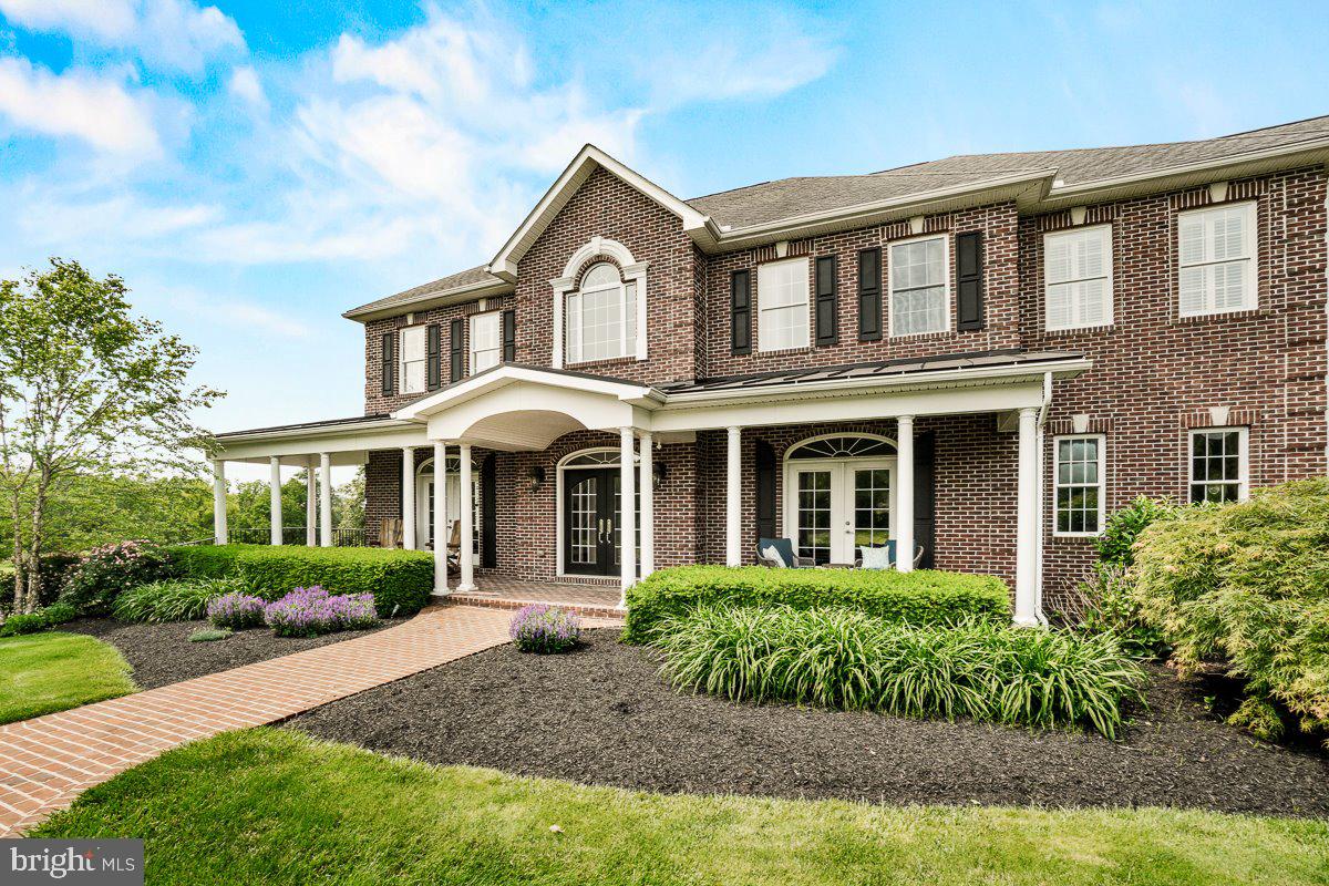 8170 Hollow Road Middletown, MD 21769 - Photo 2 of 67 a front view of a house with garden