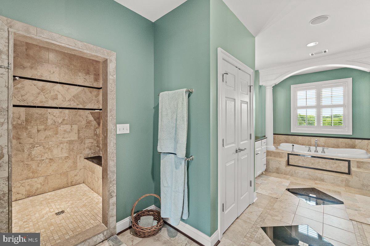 8170 Hollow Road Middletown, MD 21769 - Photo 28 of 67 a bathroom with a bathtub and a shower