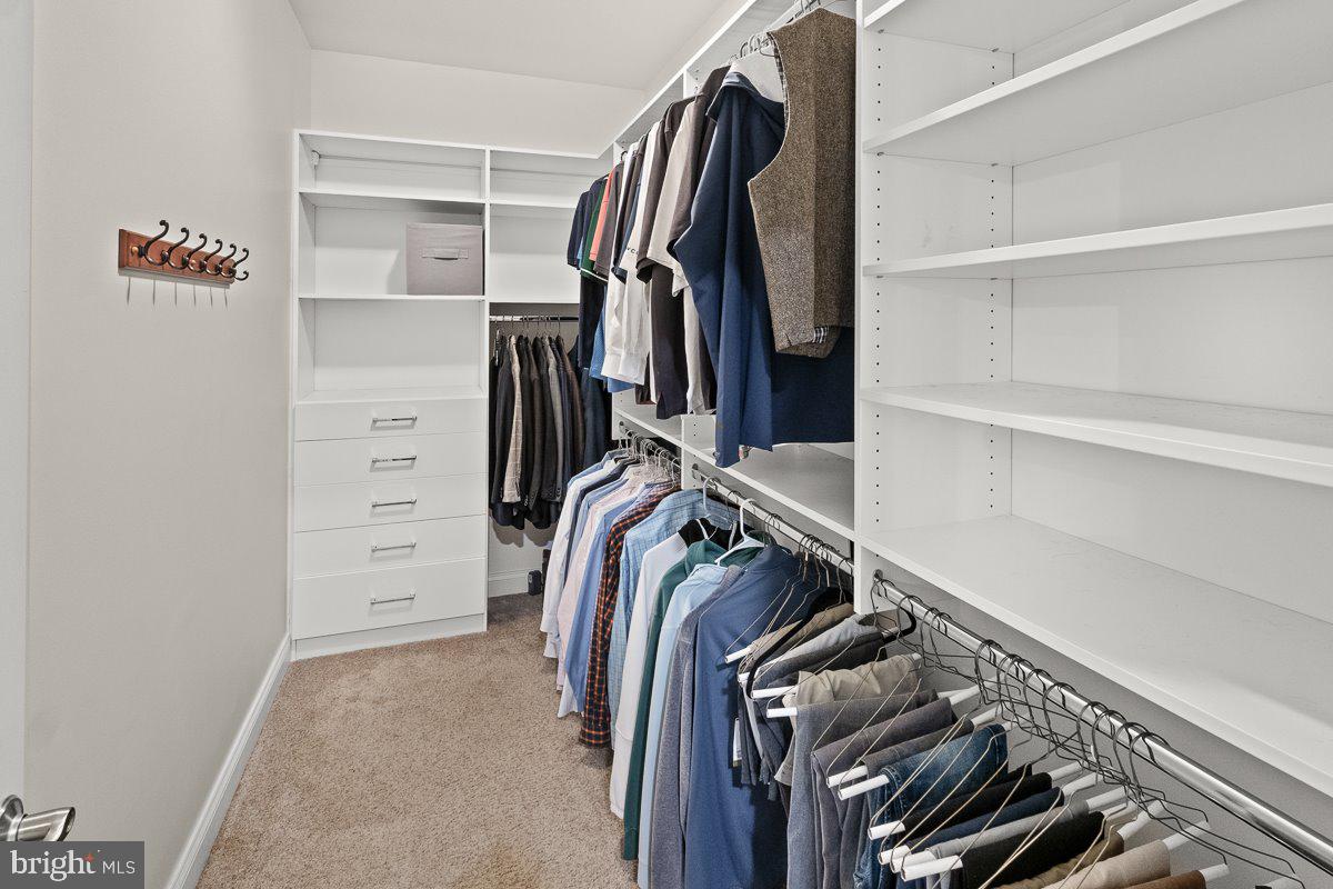 8170 Hollow Road Middletown, MD 21769 - Photo 29 of 67 a view of walk in closet with clothes and shoes
