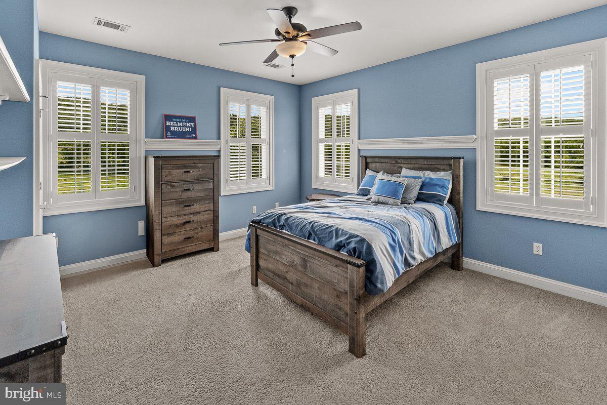 8170 Hollow Road Middletown, MD 21769 - Photo 34 of 67 a spacious bedroom with a bed dresser and a window