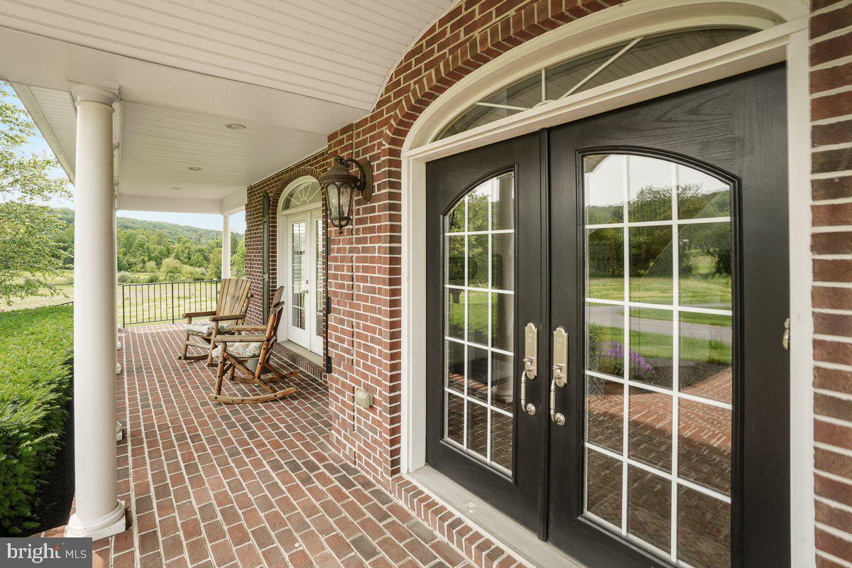 8170 Hollow Road Middletown, MD 21769 - Photo 4 of 67 a view of living room with furniture and floor to ceiling window