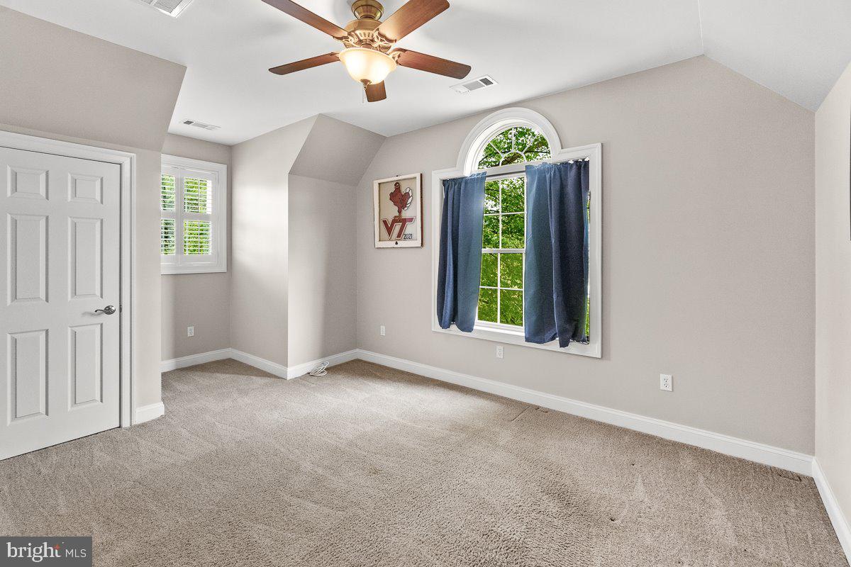 8170 Hollow Road Middletown, MD 21769 - Photo 41 of 67 an empty room with windows and fan