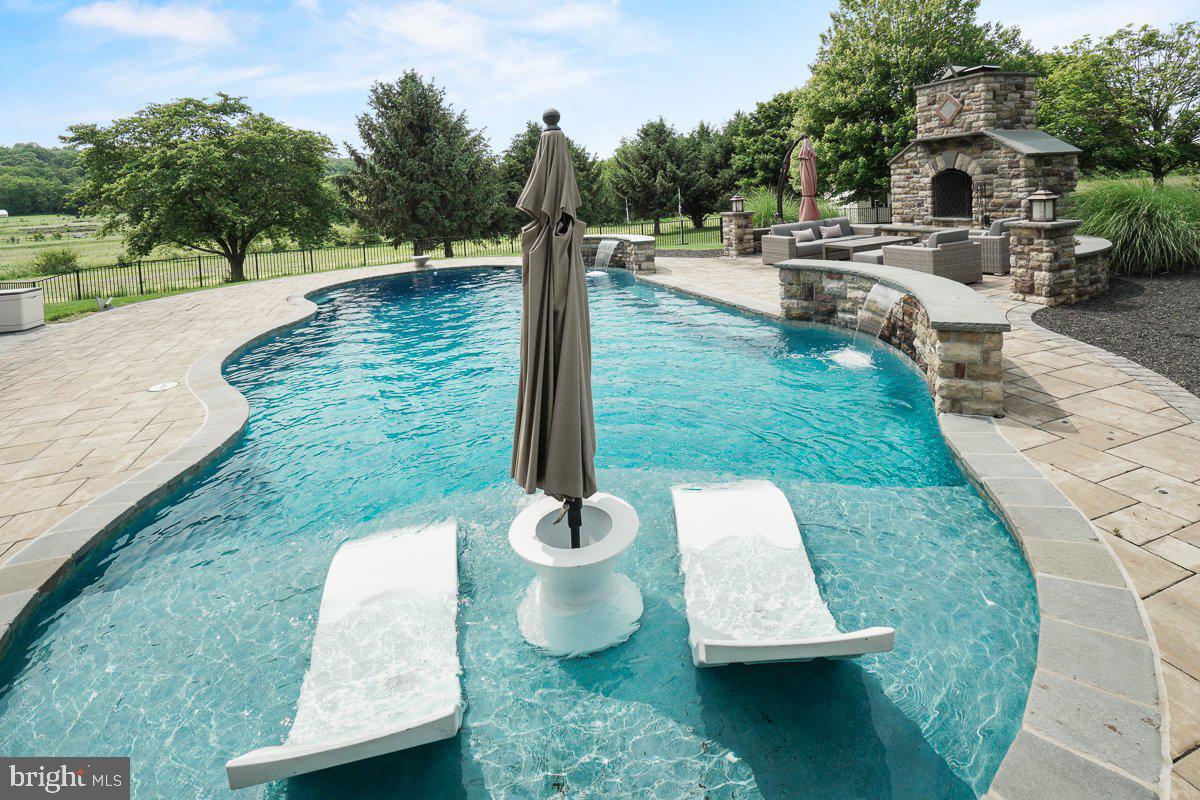 8170 Hollow Road Middletown, MD 21769 - Photo 47 of 67 a view of a swimming pool with a patio and a backyard