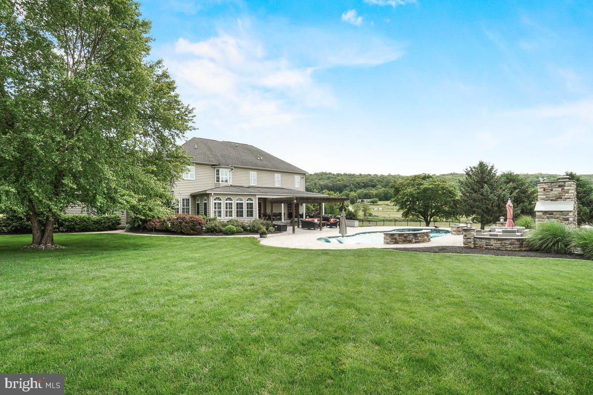 8170 Hollow Road Middletown, MD 21769 - Photo 49 of 67 a view of a house with a big yard and sitting area