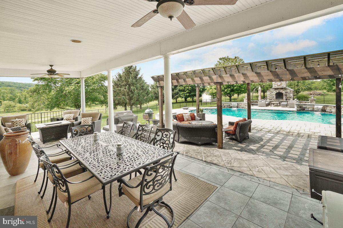 8170 Hollow Road Middletown, MD 21769 - Photo 55 of 67 a view of a patio with a dining table and chairs