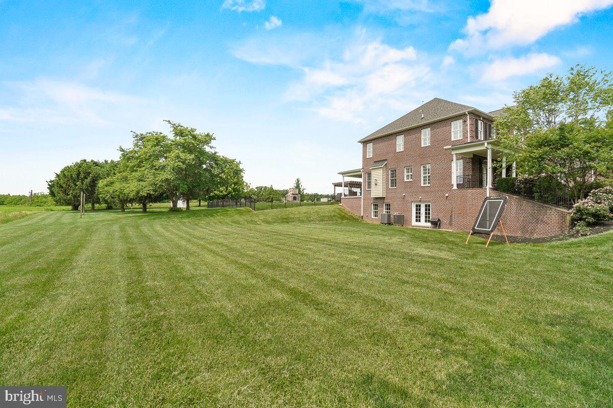 8170 Hollow Road Middletown, MD 21769 - Photo 60 of 67 a view of a house with a big yard and a large tree