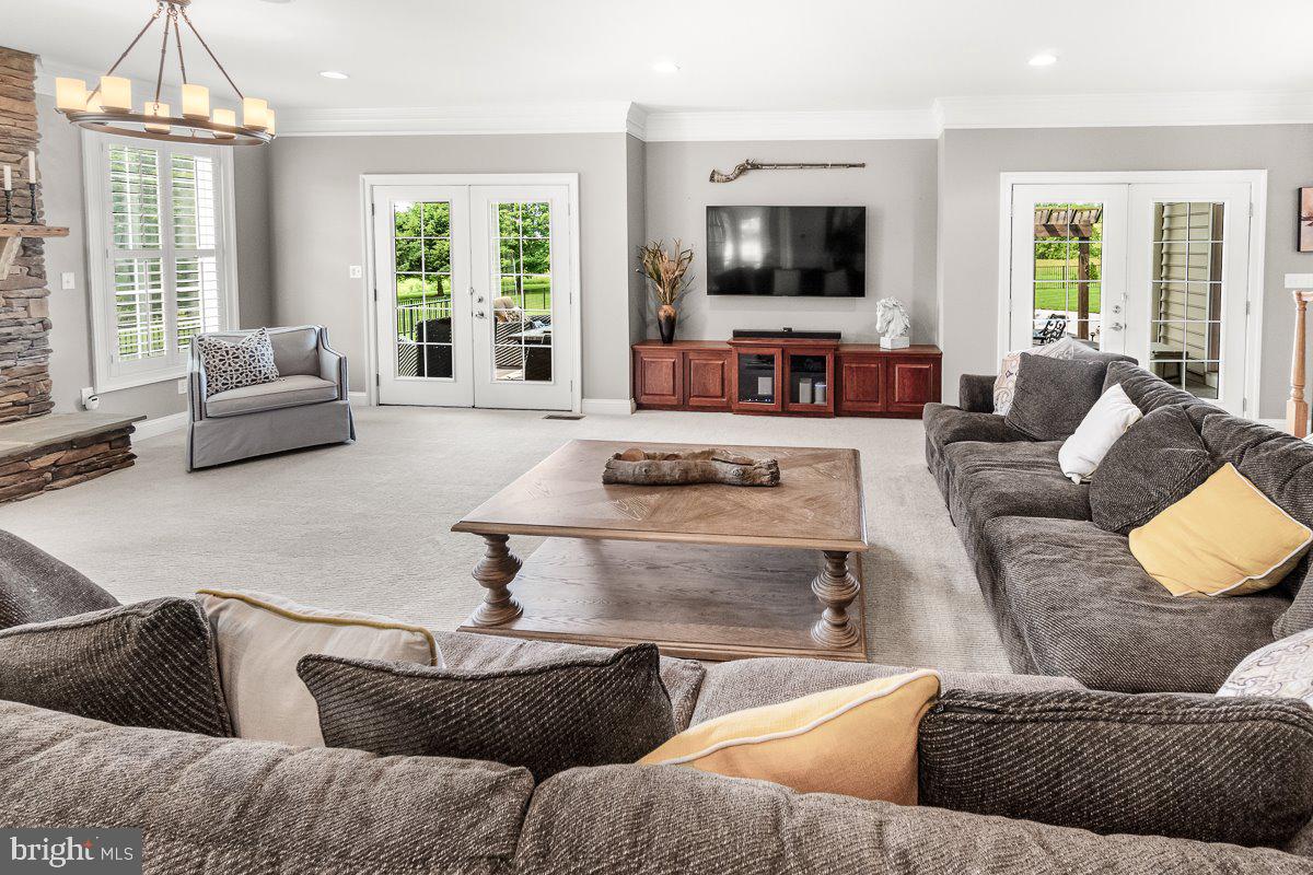 8170 Hollow Road Middletown, MD 21769 - Photo 9 of 67 a living room with furniture flat screen tv and a large window