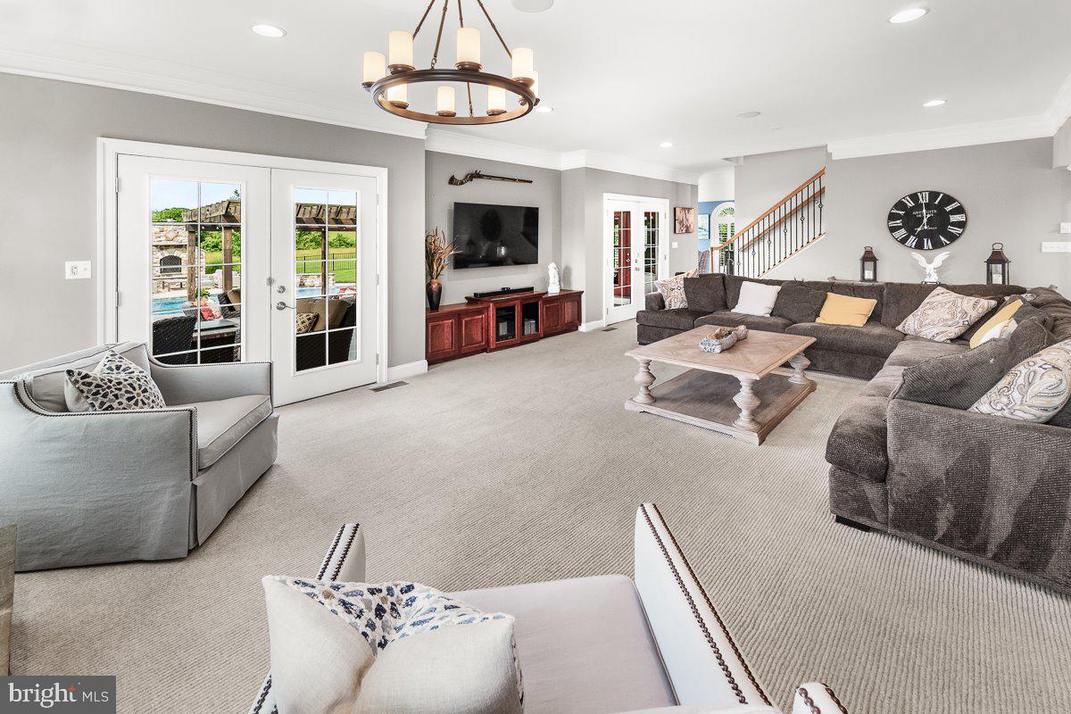 8170 Hollow Road Middletown, MD 21769 - Photo 10 of 67 a living room with furniture and a flat screen tv